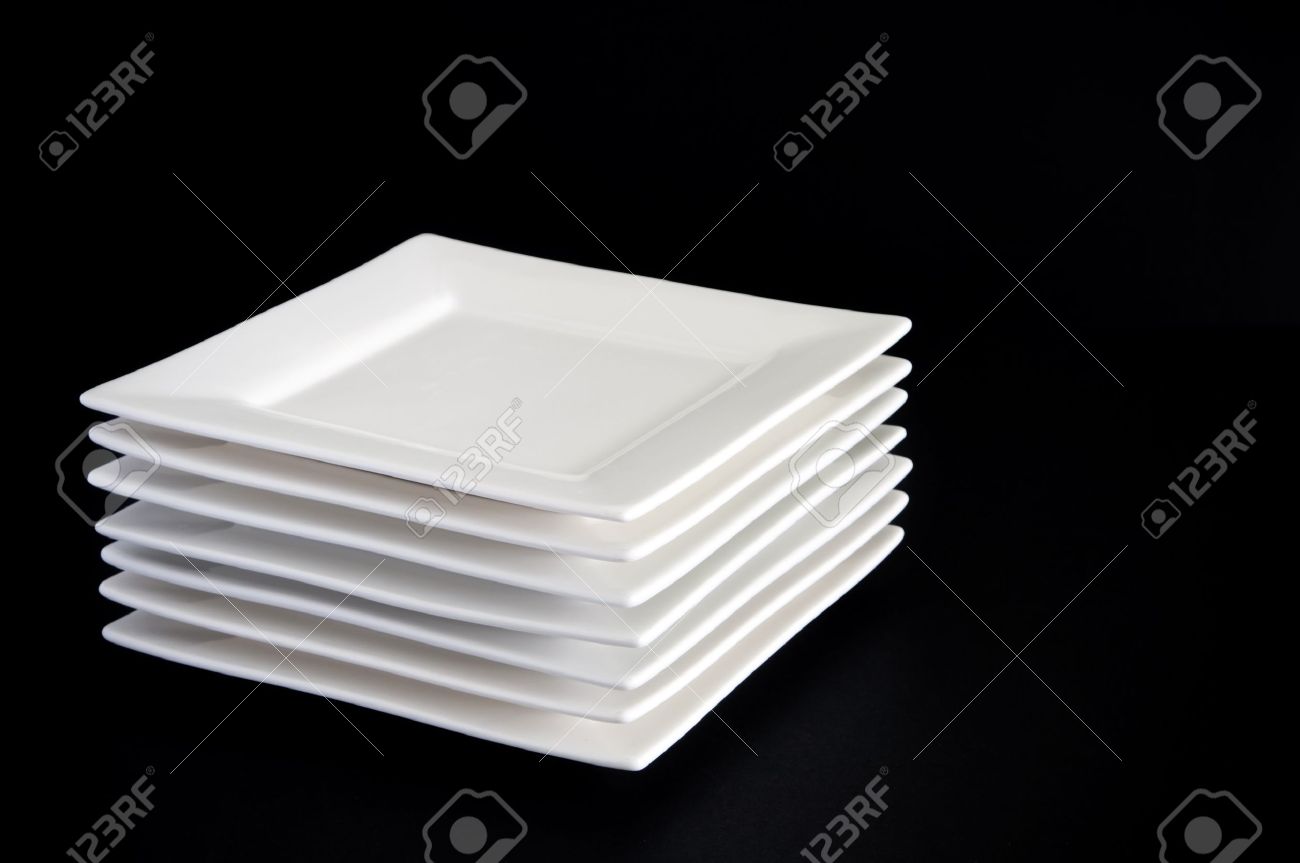 Contemporary Square White Plates Stacked Against A Dark Black - Contemporary Square White Plates Stacked Against A Dark Black Backgroundstock Photo contemporary square white plates stacked against a dark black - contemporary square white plates stacked against a dark black backgroundstock photo