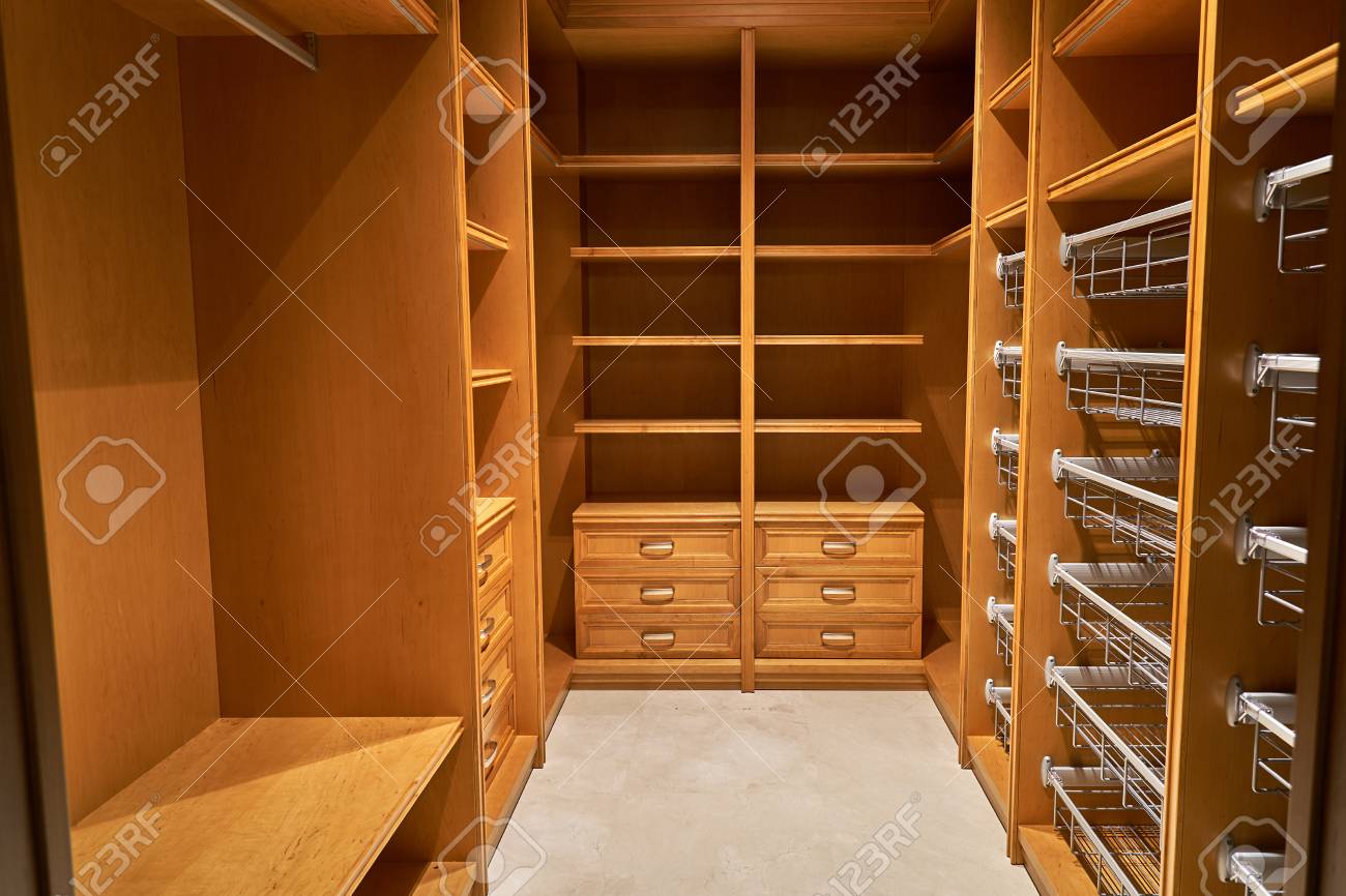 Luxury Wardrobes In The Dressing Room With Roll Out Metal Shelves