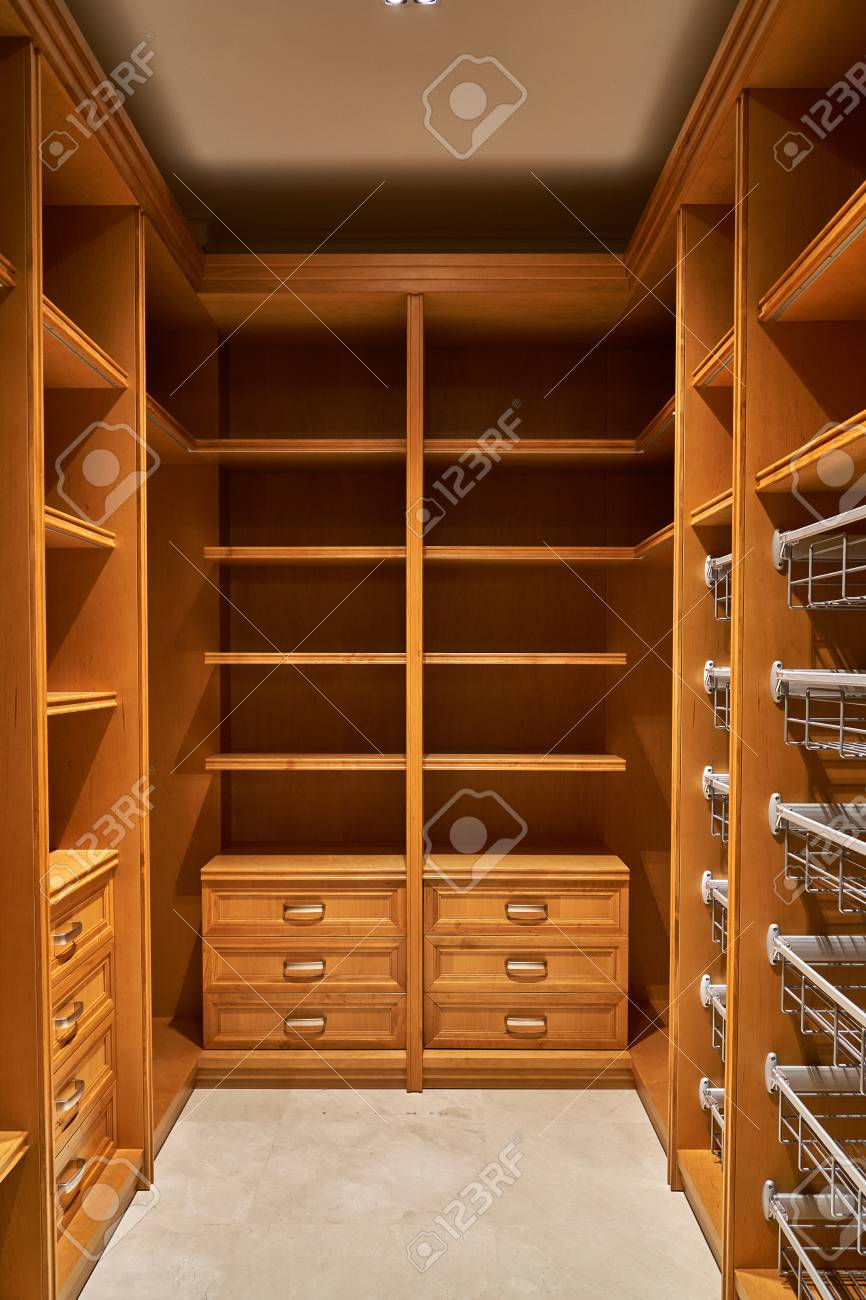 Luxury Wardrobes In The Dressing Room With Roll Out Metal Shelves