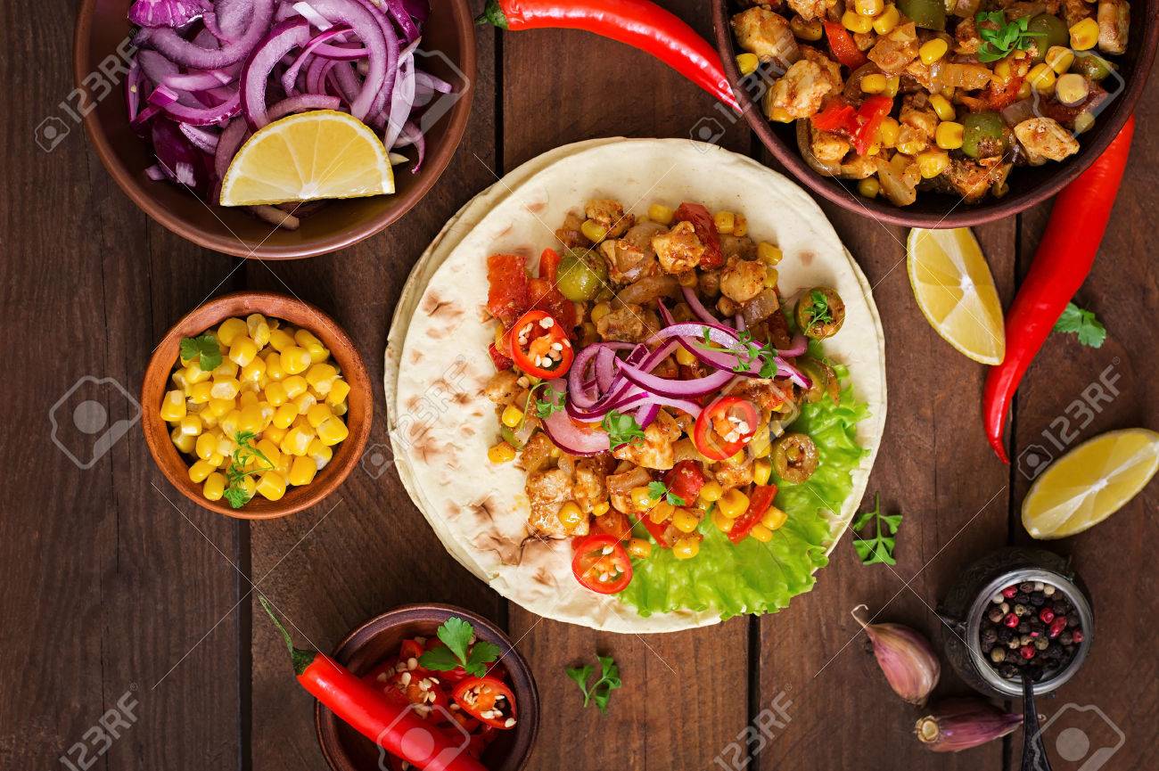 Mexican tacos with meat, corn and olives on wooden background. Top view - 51630921 Mexican tacos with meat, corn and olives on wooden background. Top view - 51630921