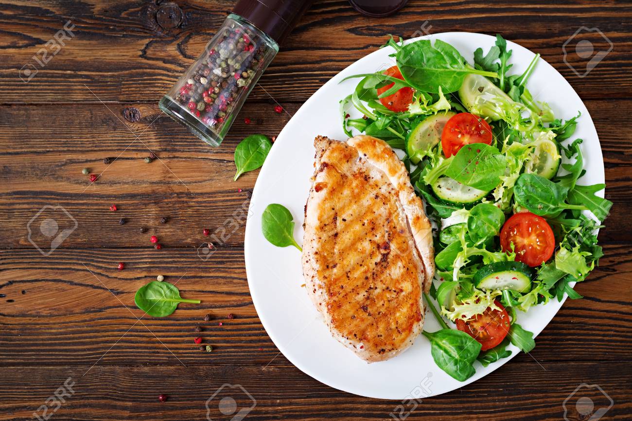 Grilled Chicken Breast And Fresh Vegetable Salad Tomatoes Stock Photo Picture And Royalty Free Image Image 96613224