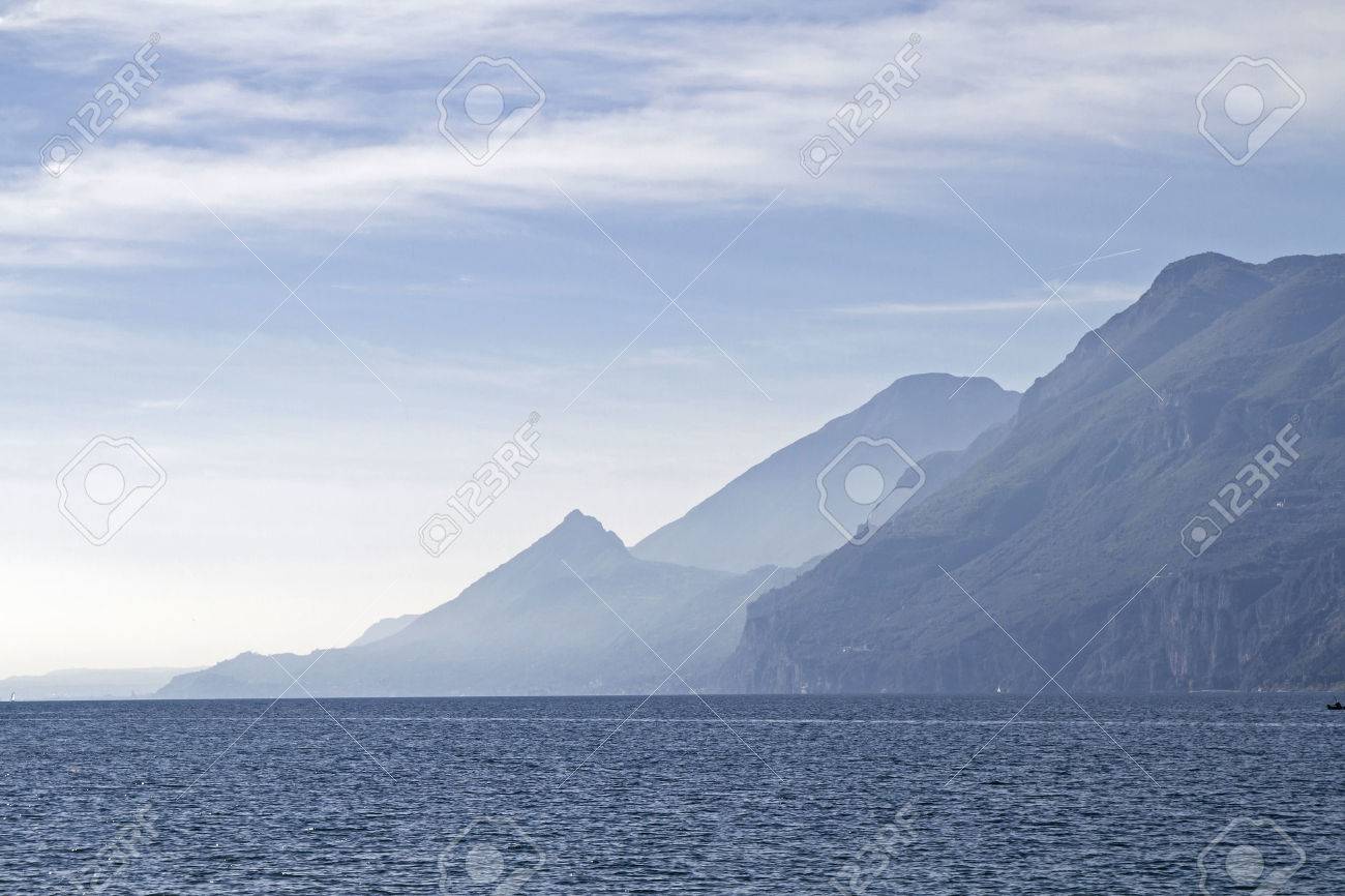 Lake Garda - lake and mountains in backlight - 48511558 Lake Garda - lake and mountains in backlight - 48511558