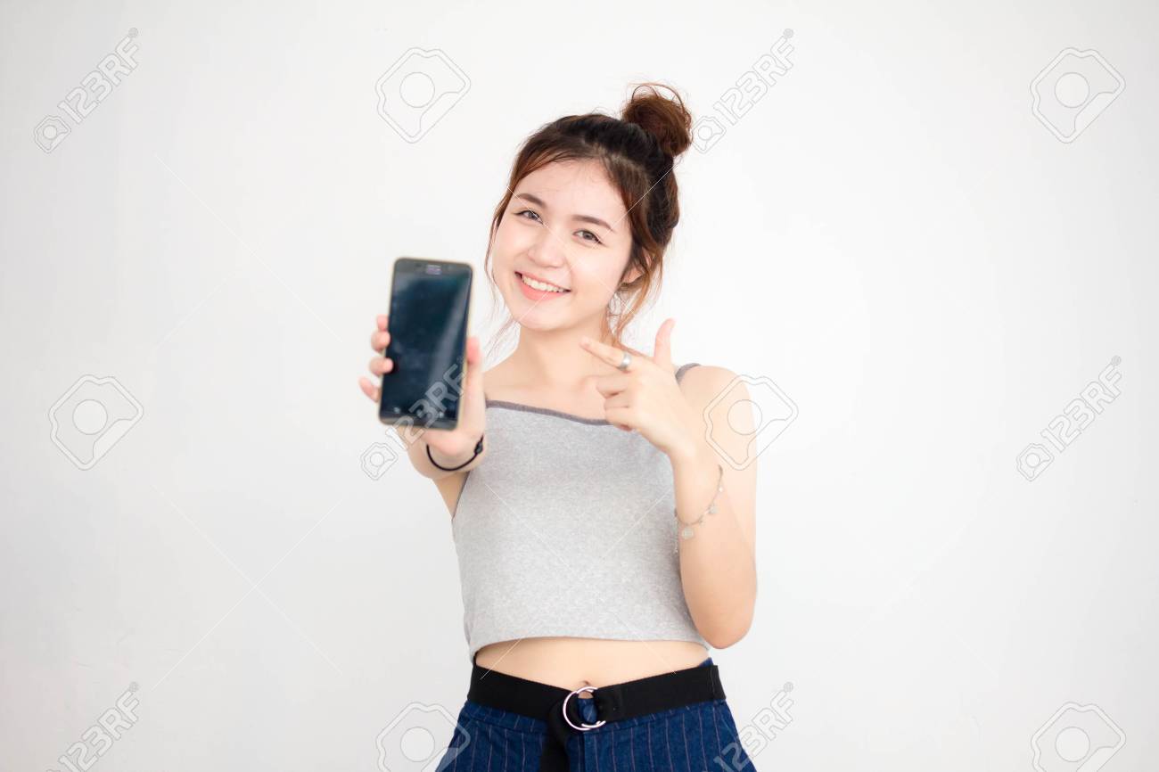 Portrait Of Thai Adult Beautiful Girl Show Her Smart Phone Stock