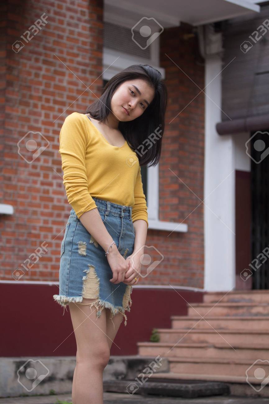 denim skirt and yellow top