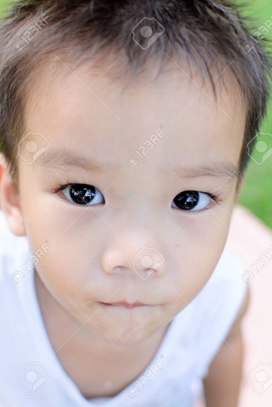 Selective Focus At The Eye Of Young Thai Boy With Cute Face Stock Photo Selective Focus At The Eye Of Young Thai Boy With Cute Face Stock Photo