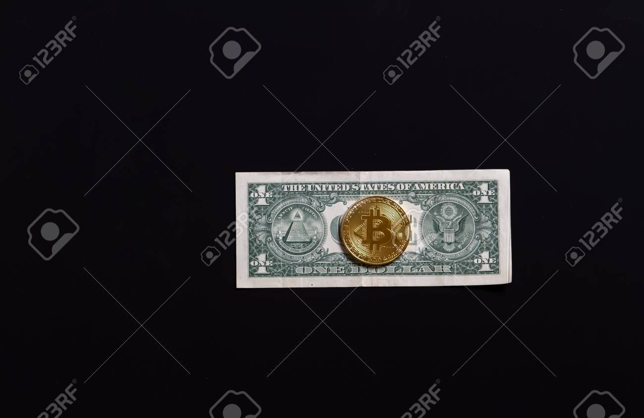 Golden Bitcoin On Us Dollar Bills Electronic Money Exchange Concept Stock  Photo, Picture and Royalty Free Image. Image 93509867.