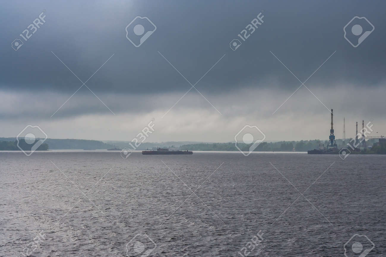 Rain and clouds over the river and the city at summer - 145773444 Rain and clouds over the river and the city at summer - 145773444
