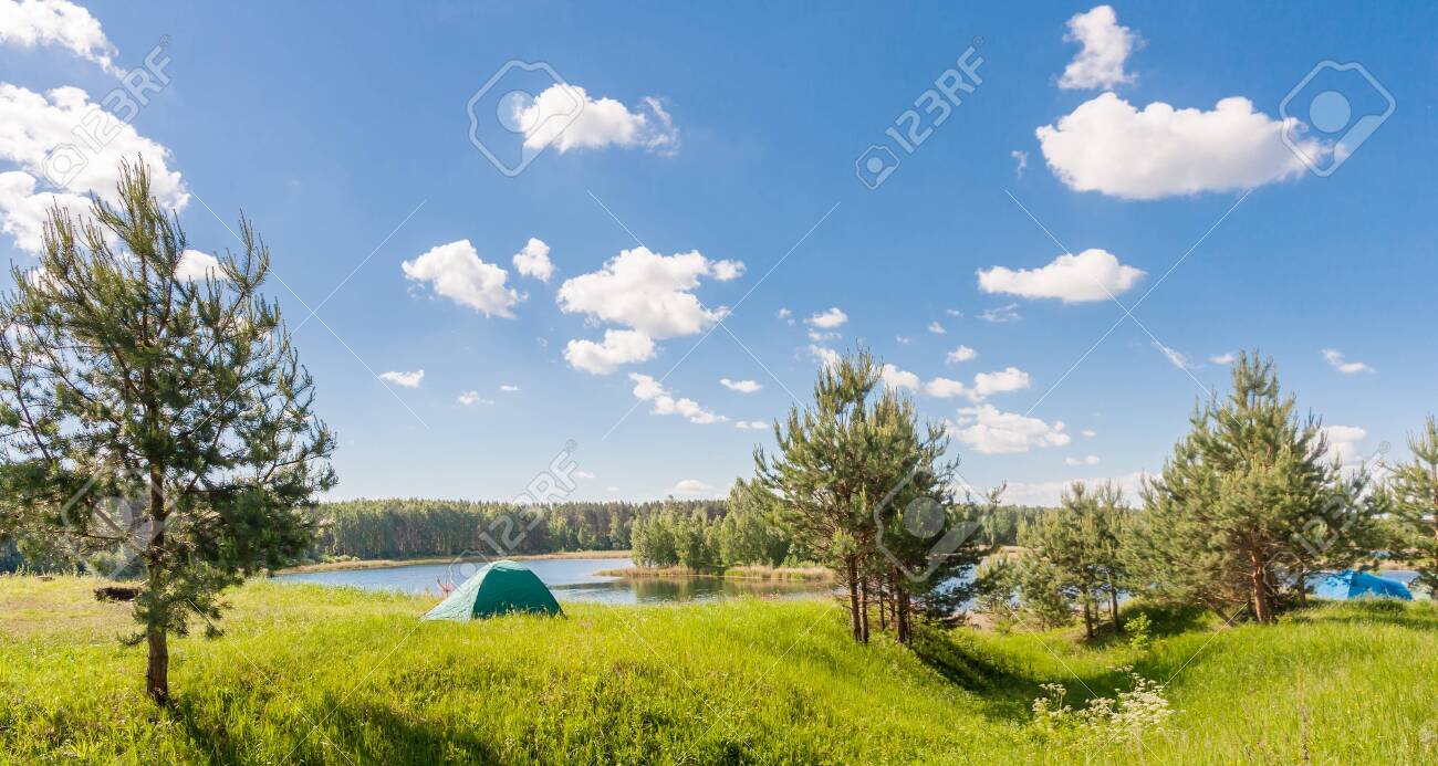 Tent on the lake in summer in Russia - 145331459 Tent on the lake in summer in Russia - 145331459