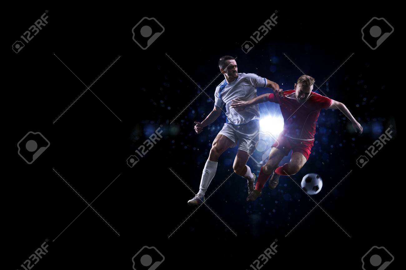 Soccer players in action over black background - 50612720 Soccer players in action over black background - 50612720