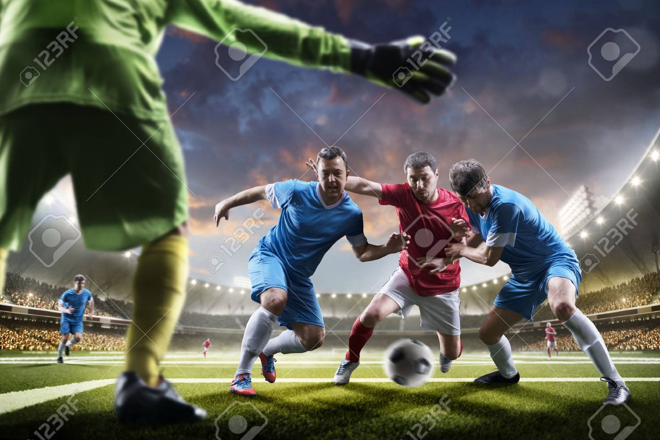 Soccer players in action on the sunset stadium background panorama - 57836244 Soccer players in action on the sunset stadium background panorama - 57836244