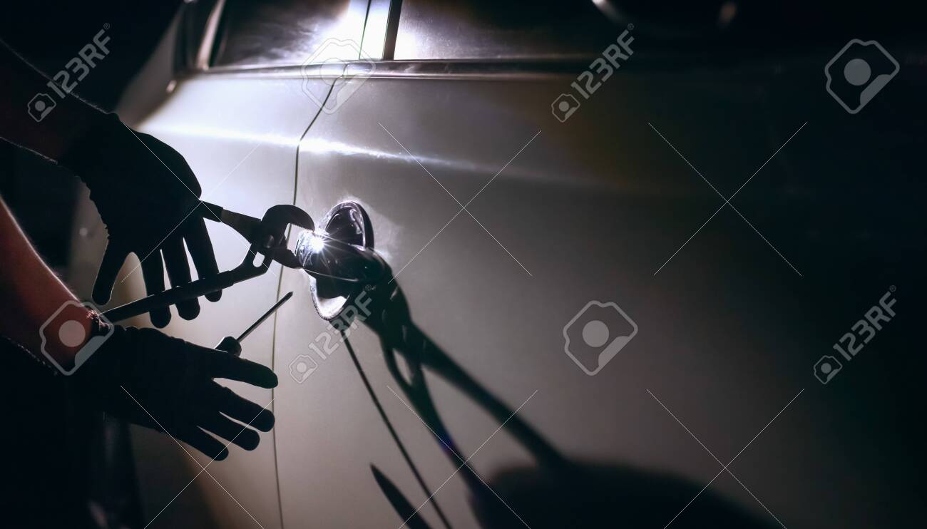 Car Thief Using A Tool To Break Into A Car Stock Photo Picture And Royalty Free Image Image Car Thief Using A Tool To Break Into A Car Stock Photo Picture And Royalty Free Image Image