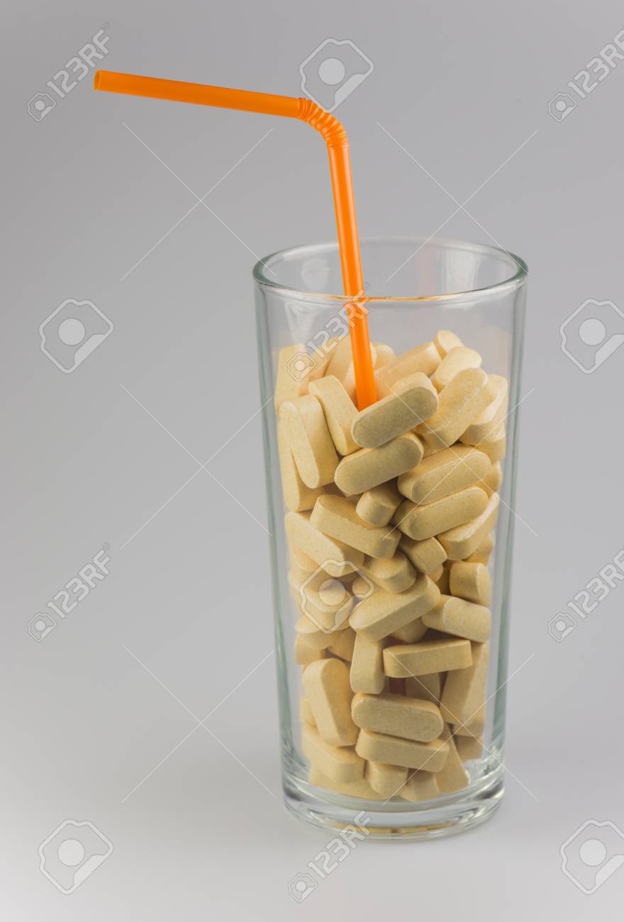 Conceptuel vitamin drink with orange straw - 47006569 Conceptuel vitamin drink with orange straw - 47006569
