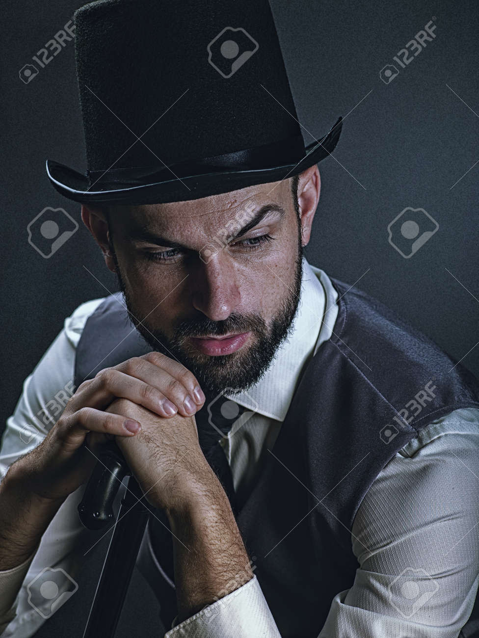 The gentleman. Dramatic male portrait with classic light and retro dress - 168857915 The gentleman. Dramatic male portrait with classic light and retro dress - 168857915