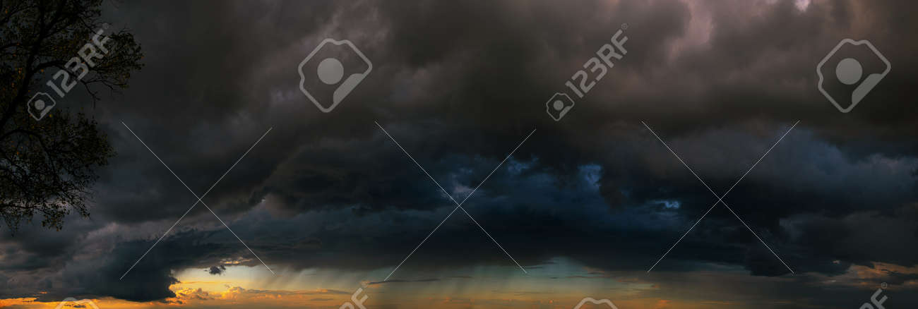 Last minutes before the storm. Dramatic skies under evening sea - 159256694 Last minutes before the storm. Dramatic skies under evening sea - 159256694