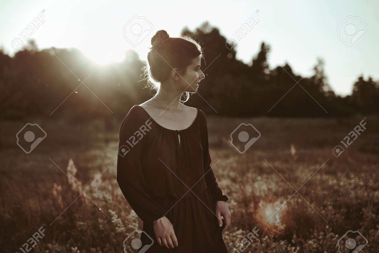 Summer Portrait. Young adult woman walking around meadow - 159316655 Summer Portrait. Young adult woman walking around meadow - 159316655