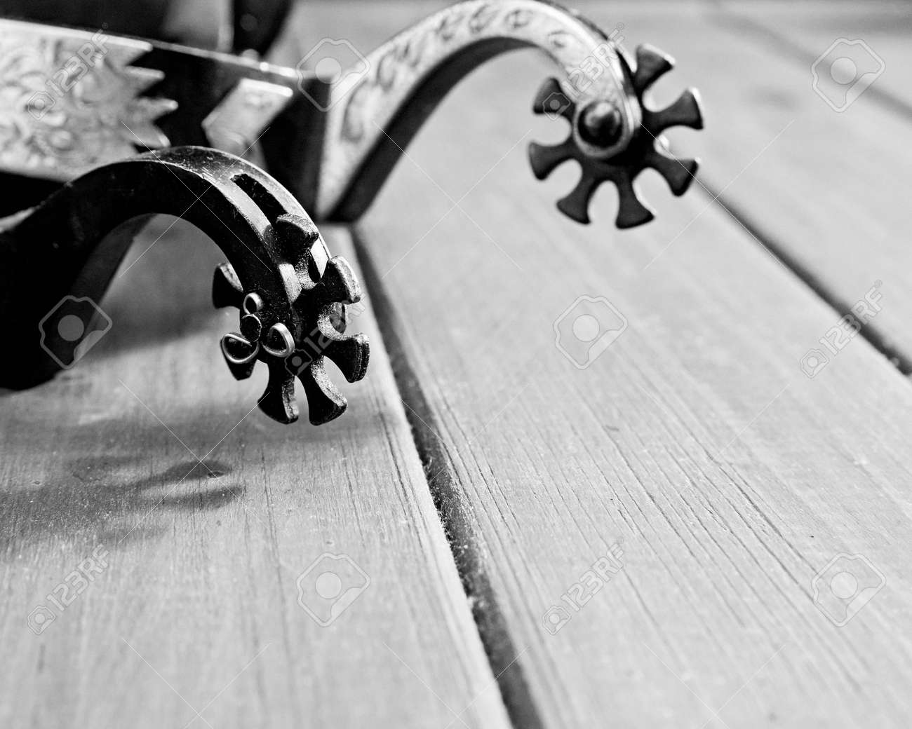 Retro still life. Spurs over vintage wooden desk - 159256857 Retro still life. Spurs over vintage wooden desk - 159256857