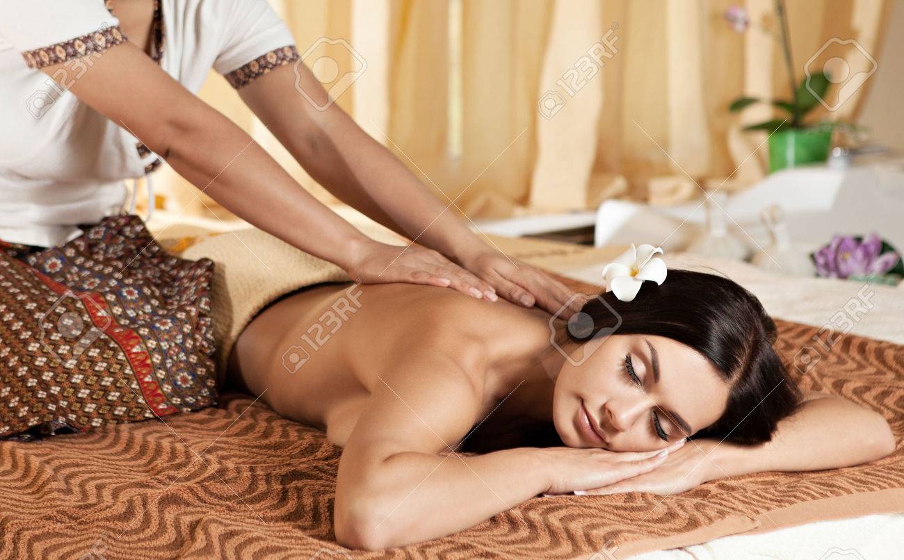Thai Massagist Doing Massage For