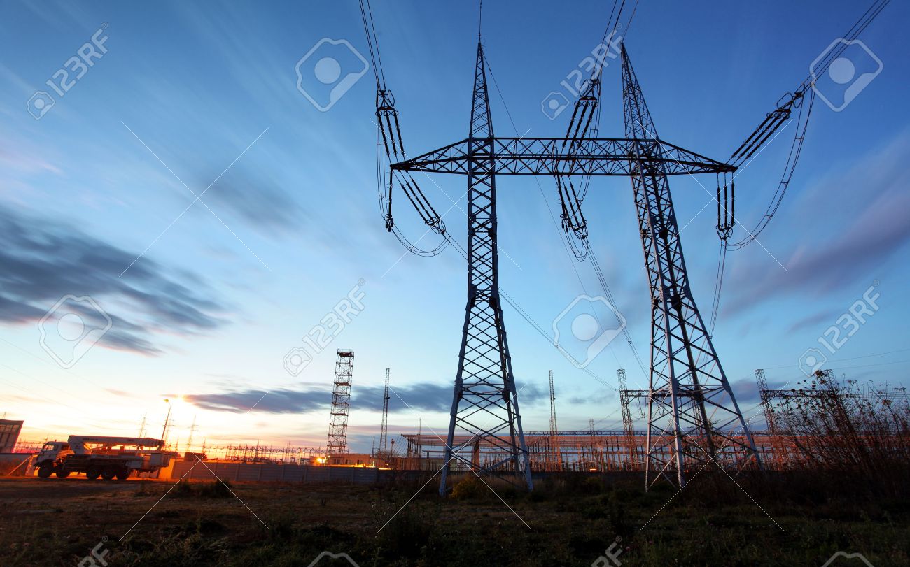 electricity transmission pylon silhouetted against blue sky at dusk - 53132216 electricity transmission pylon silhouetted against blue sky at dusk - 53132216