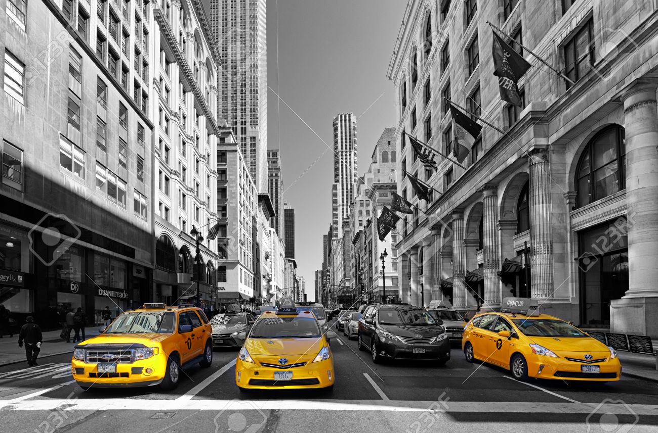 NEW YORK - APRIL 15: Yellow taxis rides on 5th Avenue on April 15 2016 in New York, USA. 5th Avenue is a central road of Manhattan, the most expensive shops and apartmens situated here - 59200225 NEW YORK - APRIL 15: Yellow taxis rides on 5th Avenue on April 15 2016 in New York, USA. 5th Avenue is a central road of Manhattan, the most expensive shops and apartmens situated here - 59200225