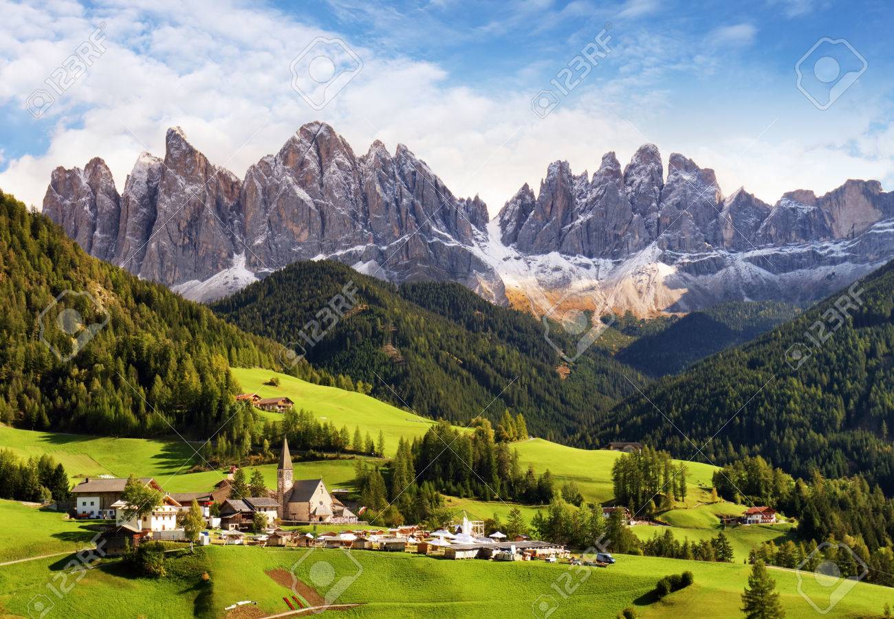 Val di Funes, Trentino Alto Adige, Italy. The great autumnal colors shines under the late sun with Odle on the background and Santa Magdalena Village on the foreground. - 66143059 Val di Funes, Trentino Alto Adige, Italy. The great autumnal colors shines under the late sun with Odle on the background and Santa Magdalena Village on the foreground. - 66143059