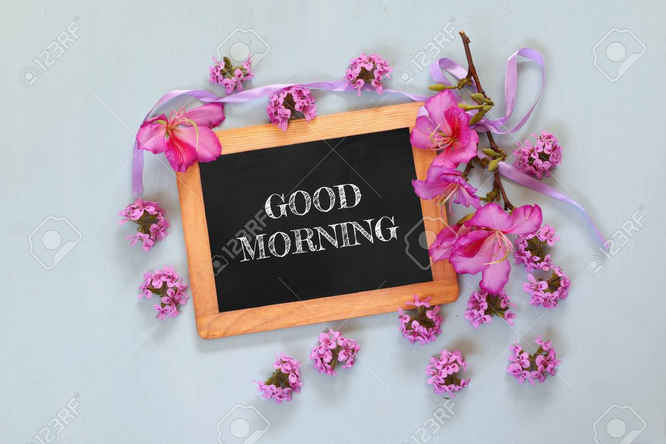 Blackboard With The Phrase Good Morning Written On It Next To