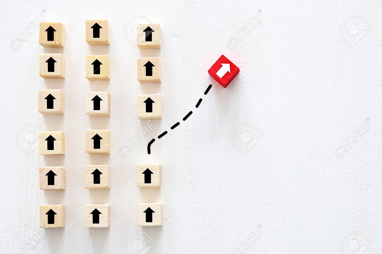 Concept of think different, innovation and creativity. Red cube changing direction from others - 114466351 Concept of think different, innovation and creativity. Red cube changing direction from others - 114466351