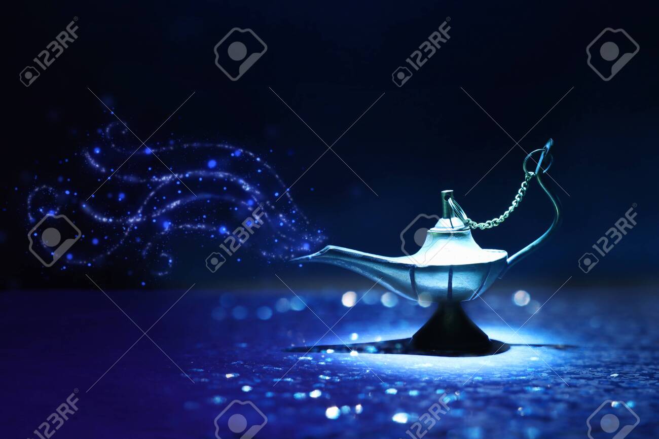 Image of magical mysterious aladdin lamp with glitter smoke. Dark background and dramatic light - 124058154 Image of magical mysterious aladdin lamp with glitter smoke. Dark background and dramatic light - 124058154