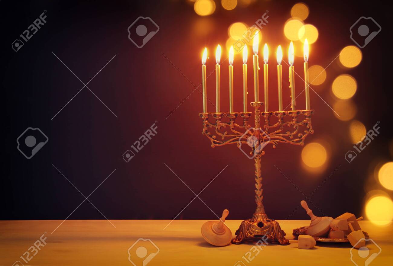 Religion image of jewish holiday Hanukkah background with menorah (traditional candelabra) and dreidels - 133147582 Religion image of jewish holiday Hanukkah background with menorah (traditional candelabra) and dreidels - 133147582