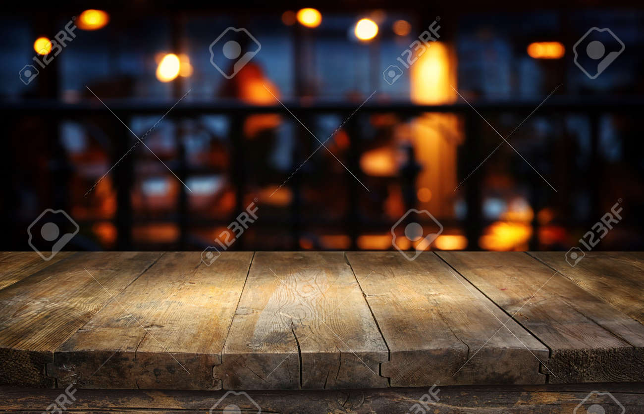background Image of wooden table in front of abstract blurred restaurant lights - 137390440 background Image of wooden table in front of abstract blurred restaurant lights - 137390440