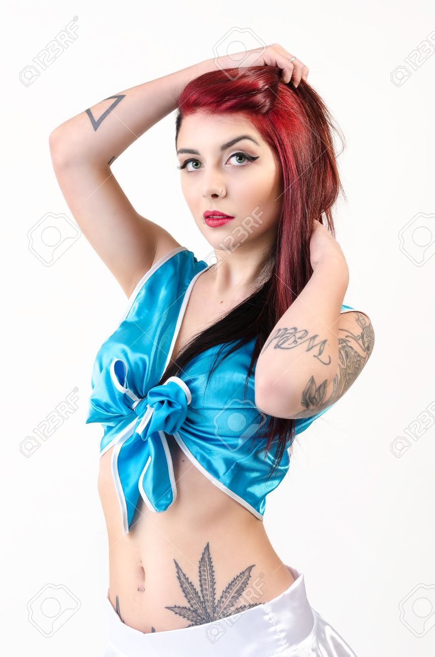 beautiful redhead with tattoos in pinup style and white beautiful redhead with tattoos in pinup style and white