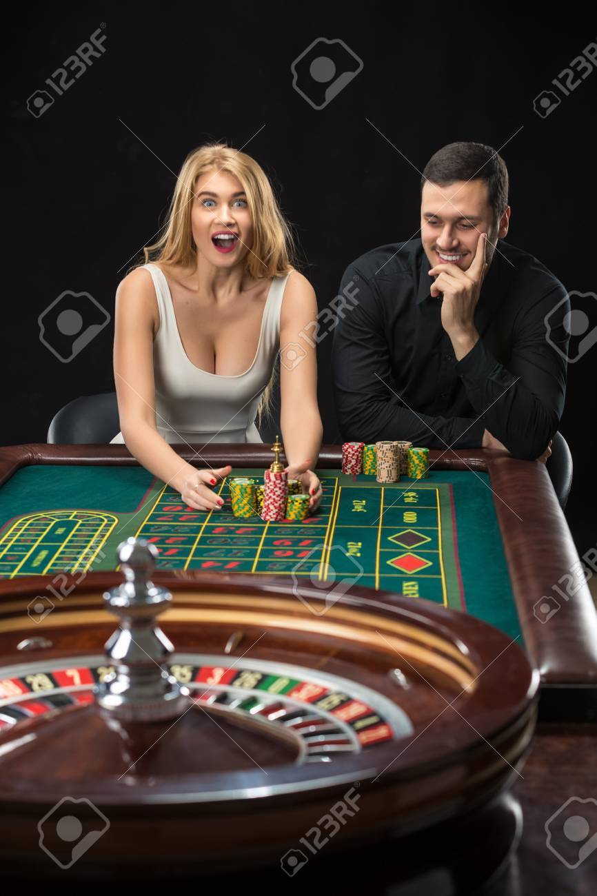 Couple Playing Roulette Wins At The Casino. Addiction To The Gambling Stock Photo, Picture And Royalty Free Image. Image 51210917.