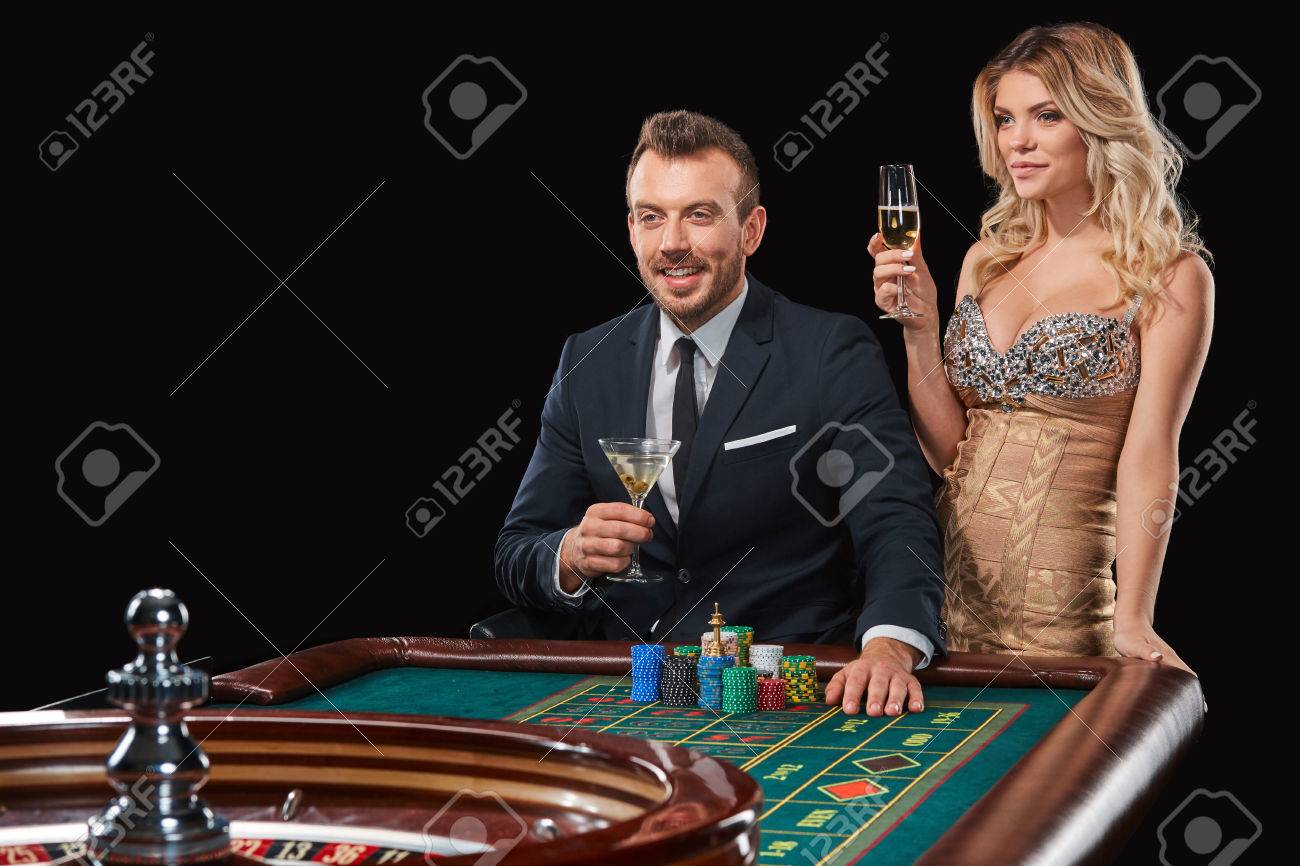 Couple Playing Roulette Wins At The Casino. Addiction To The Gambling. Happy Win Stock Photo, Picture And Royalty Free Image. Image 66401482.