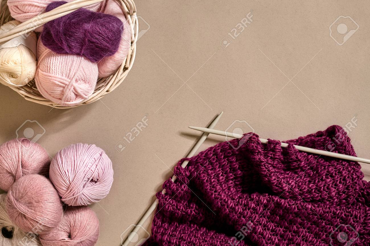 Balls Of Merino Wool Yarn Knitting On Knitting Needles On A