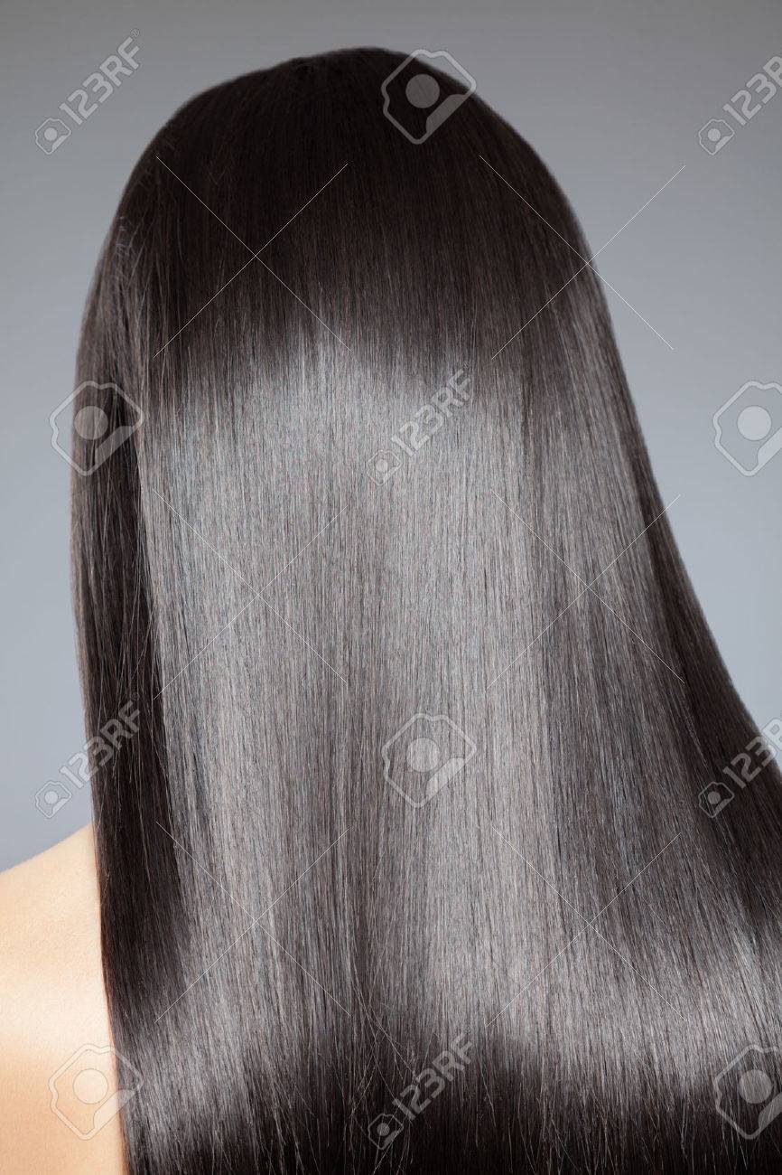 Back view of a woman with long straight hair - 36958681 Back view of a woman with long straight hair - 36958681