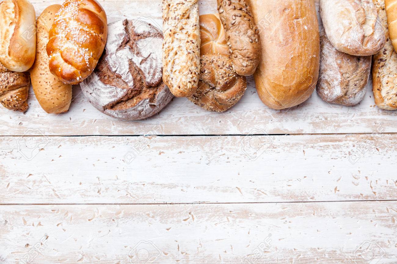 Delicious Freshly Baked Bread On Wooden Background Stock Photo