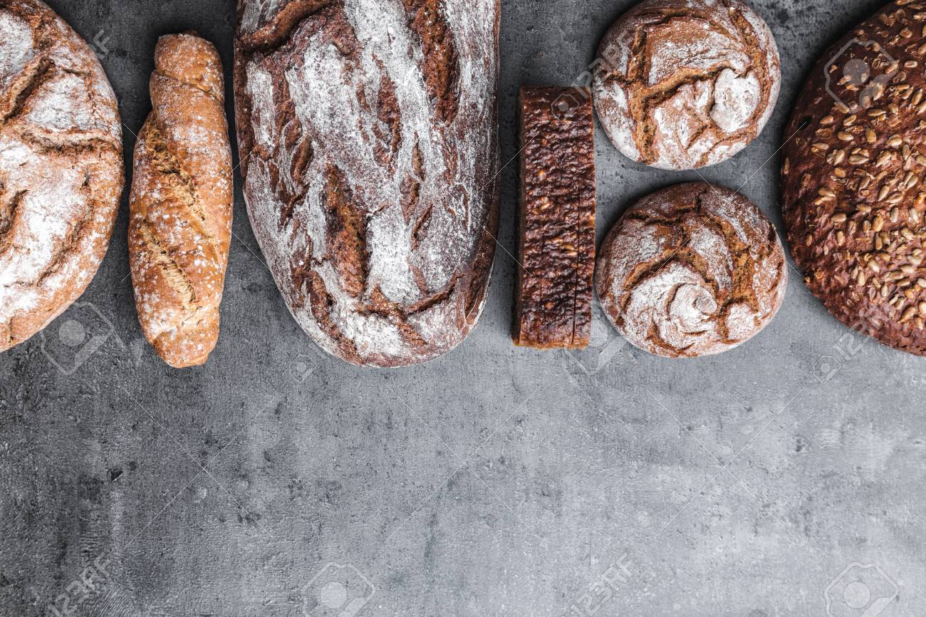Delicious freshly baked brown bread on wooden background - 80731534 Delicious freshly baked brown bread on wooden background - 80731534