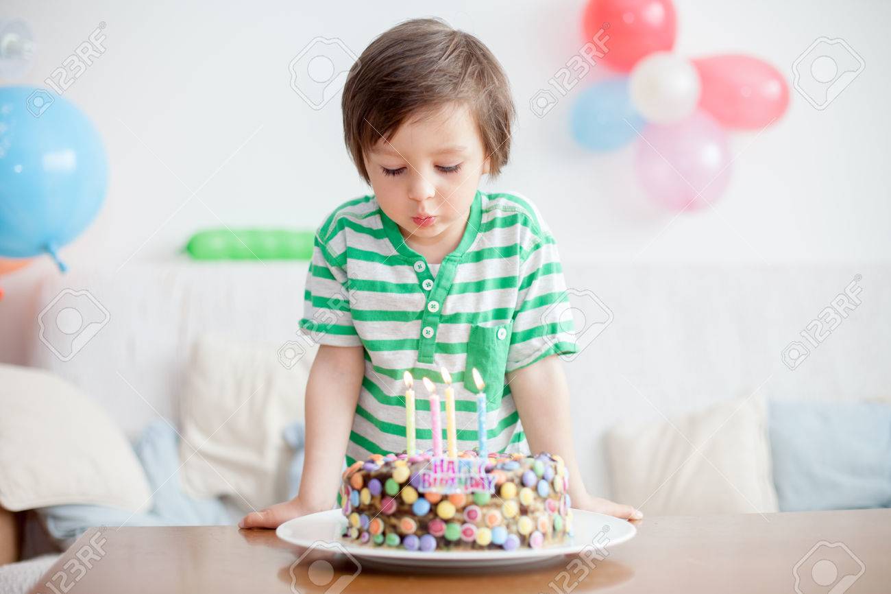 Beautiful Adorable Four Year Old Boy In Green Shirt Celebrating