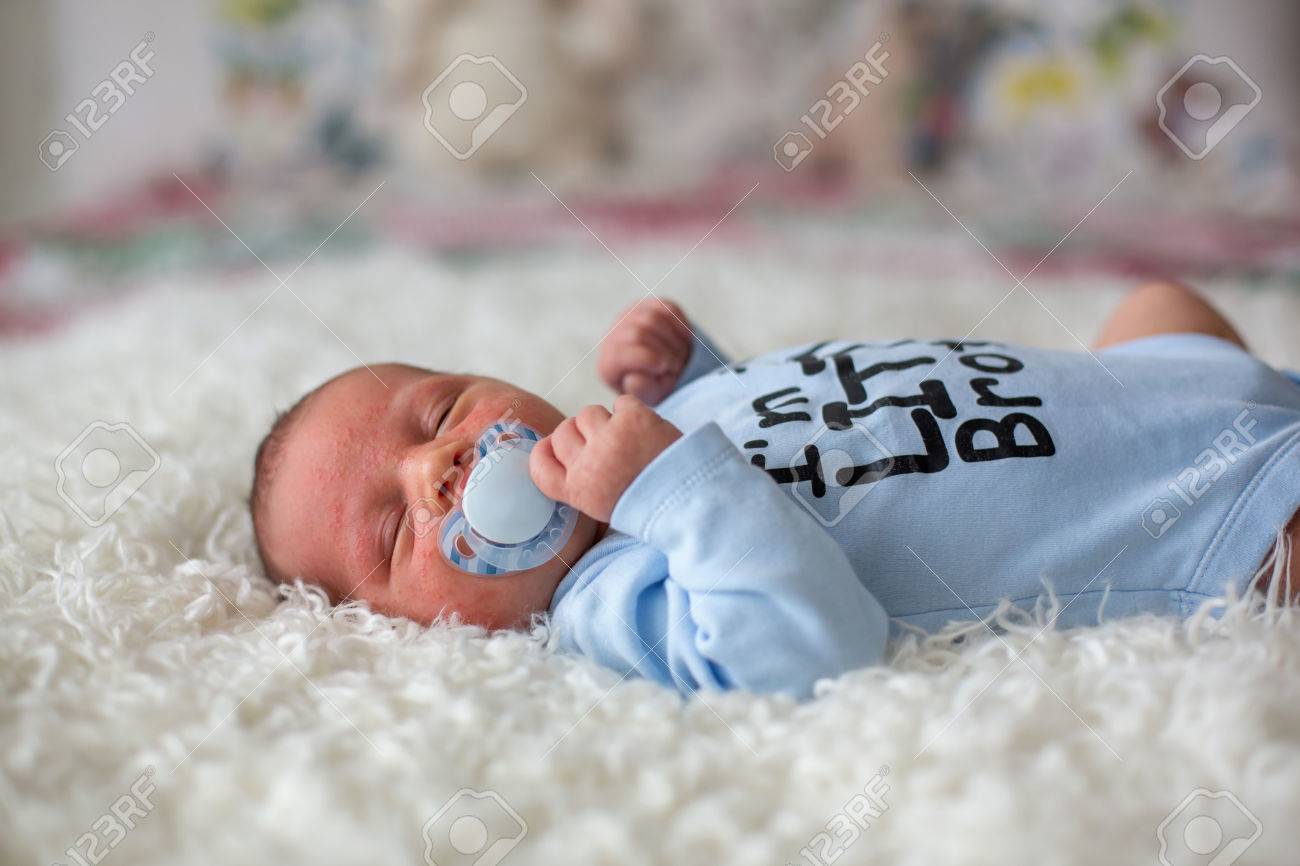 baby sleeping with pacifier