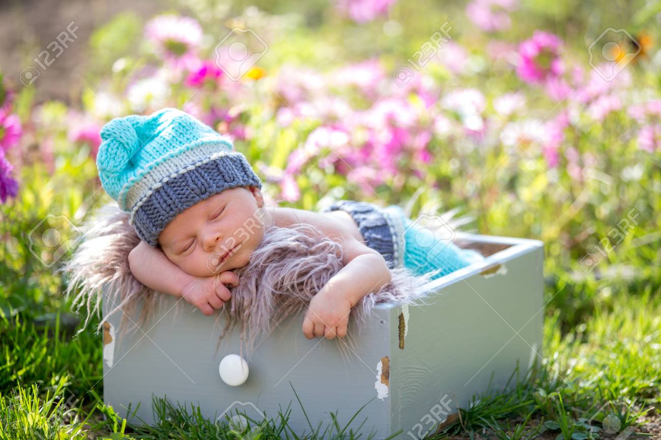 baby boy with flowers