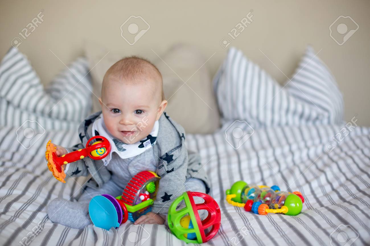 little baby playing with toys
