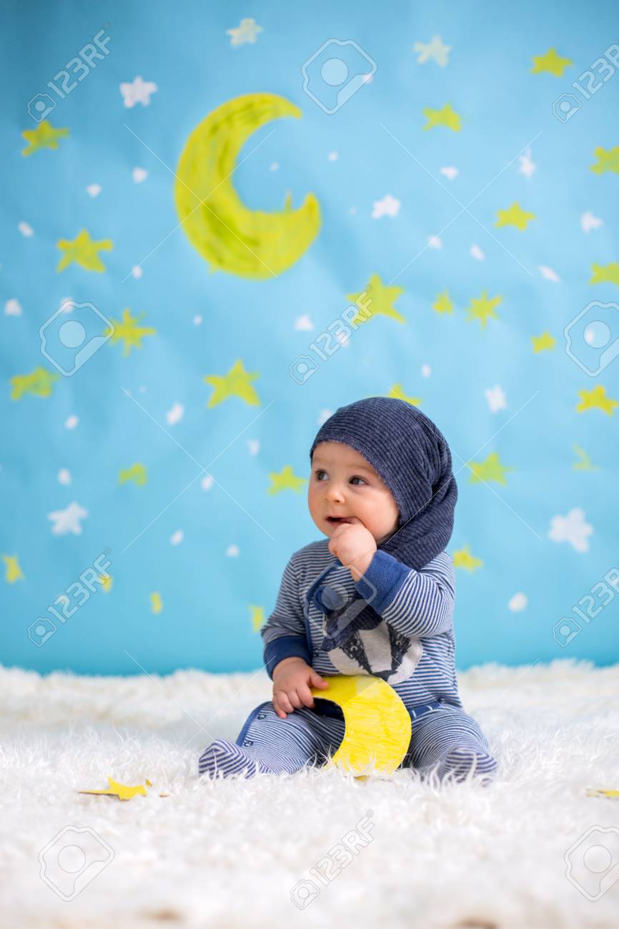 Little Child Baby Boy With Cute Teddy Bear And Moon On A Blue