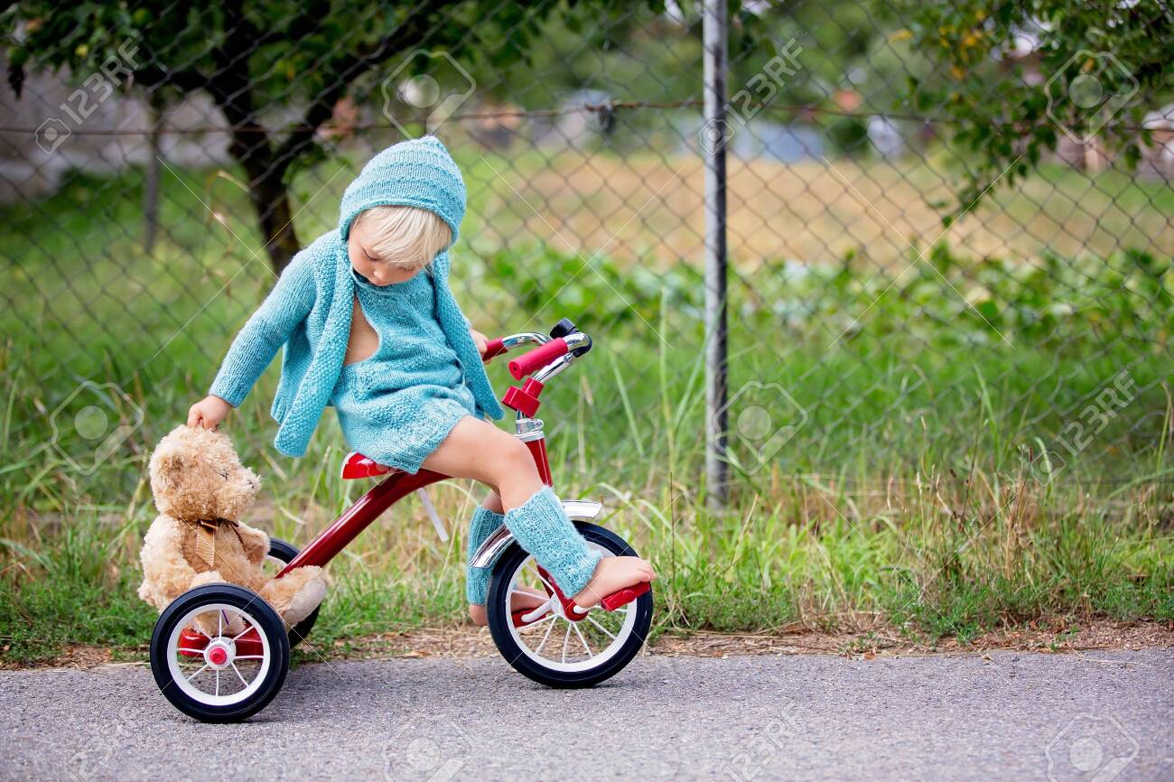 toddler riding tricycle