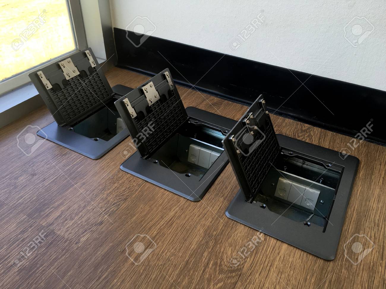 Floor Plug Pop Up Plug In Metal Cover Installed In Wooden Floor