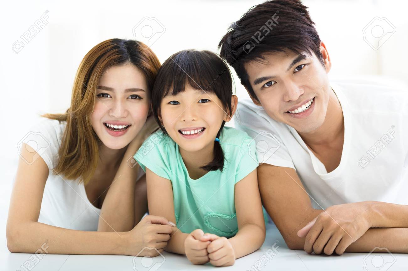 Happy Attractive Young Family and little girl - 60366025 Happy Attractive Young Family and little girl - 60366025