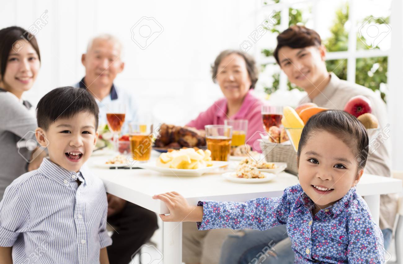 happy asian family having dinner at home - 89509935 happy asian family having dinner at home - 89509935