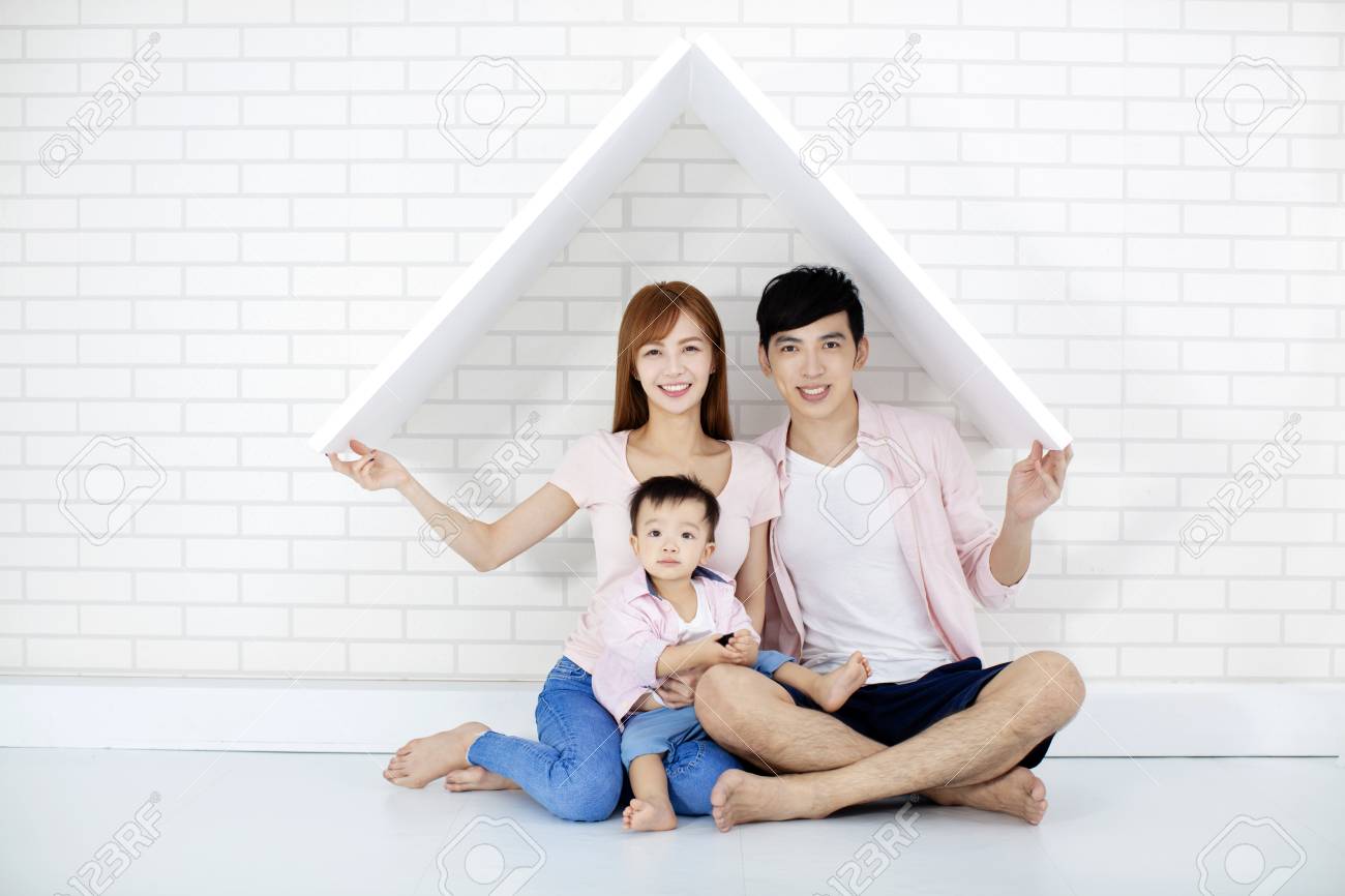 happy family in new house with roof - 109213058 happy family in new house with roof - 109213058