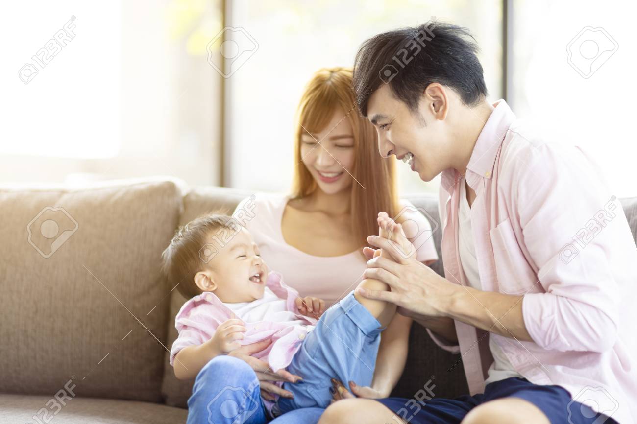 happy family mother and father playing with baby at home - 111583728 happy family mother and father playing with baby at home - 111583728