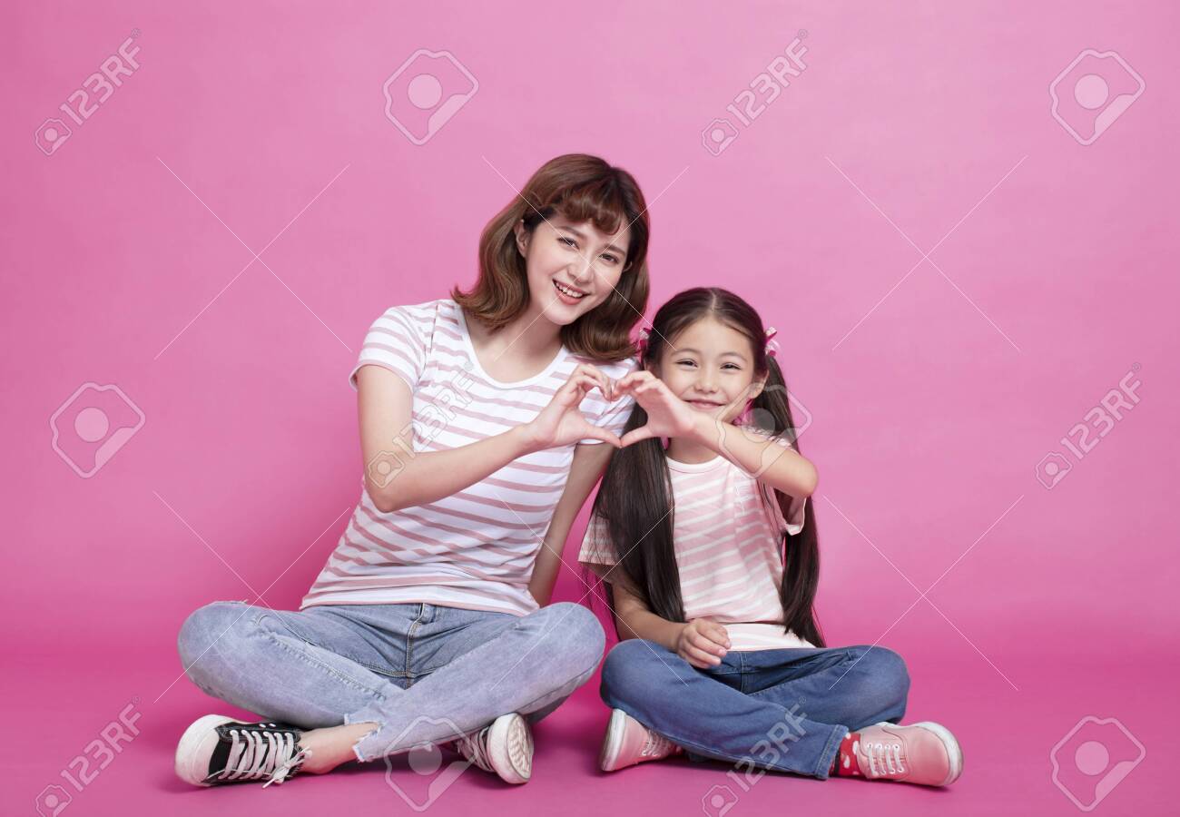 happy mother and child making hand heart - 121167671 happy mother and child making hand heart - 121167671