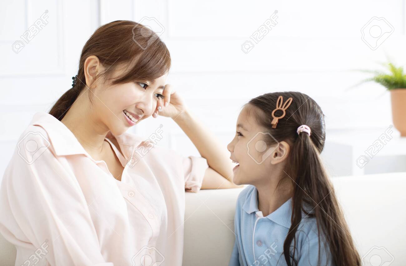 happy mother talking with little girl at home - 125110828 happy mother talking with little girl at home - 125110828