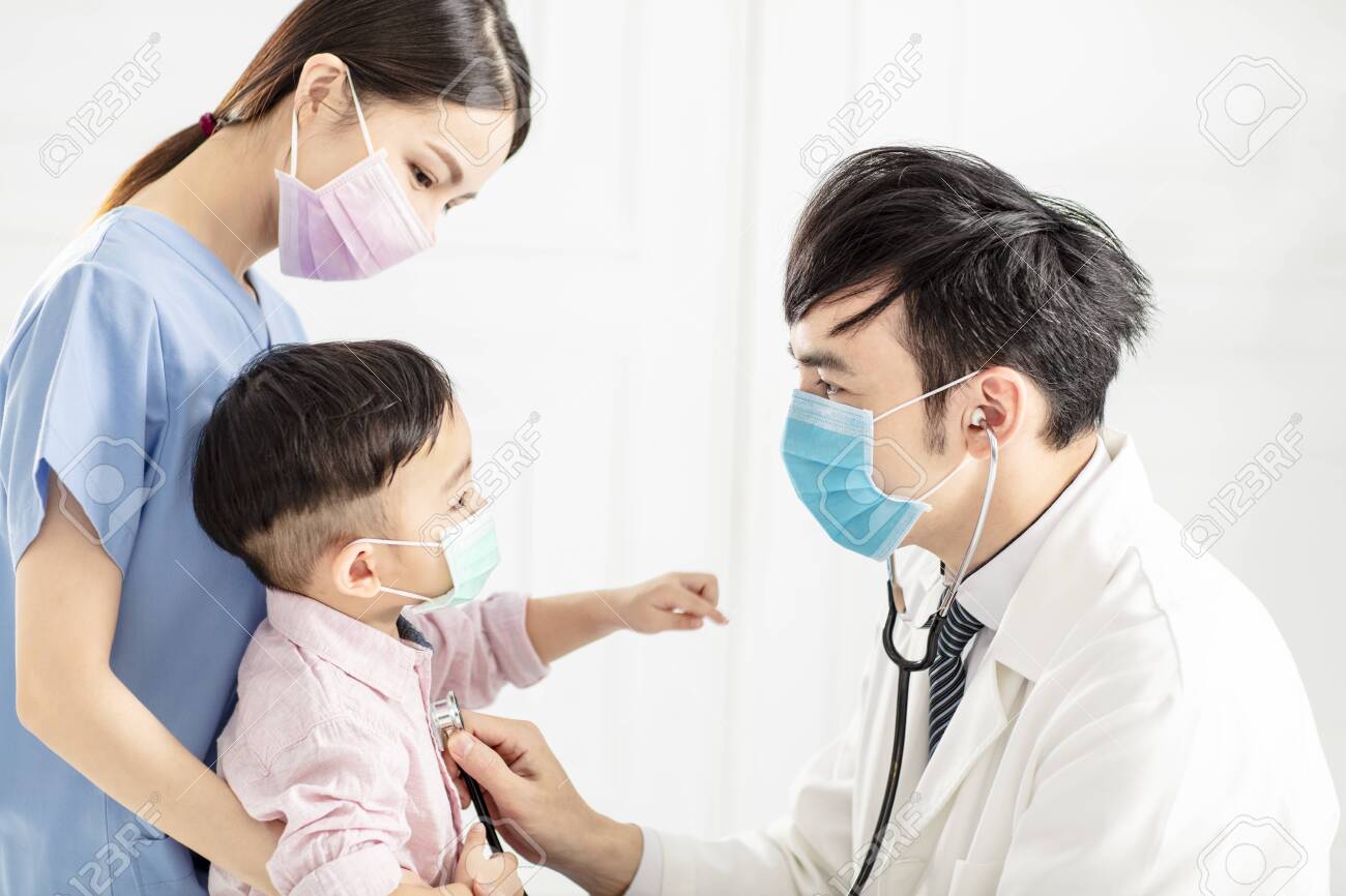 medical doctor examining little boy in clinic - 139908288 medical doctor examining little boy in clinic - 139908288